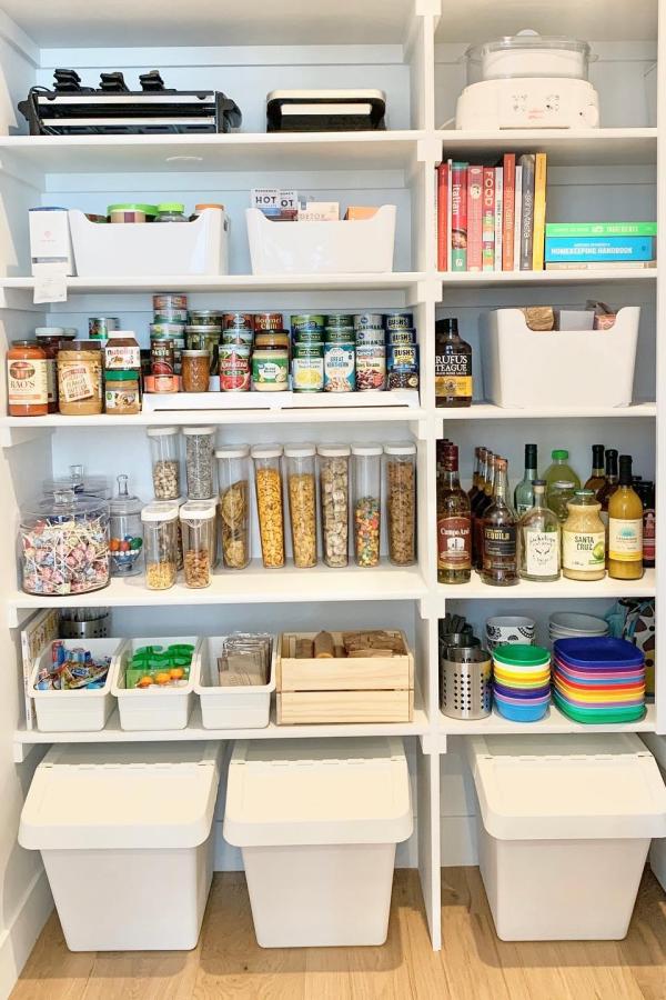 Transparent containers neatly organize spices and grains; ikea pantry ideas.