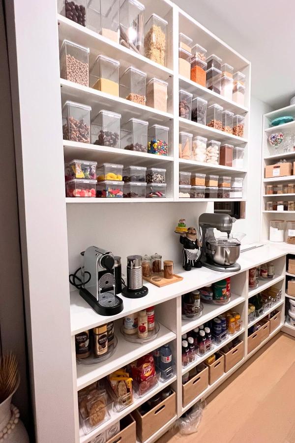 Chic acrylic containers showcase organization; inspired by ikea pantry ideas.