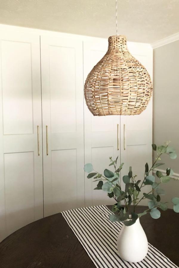 Alt text 3: Rustic rattan light pendants enhancing ambiance in cozy kitchen.