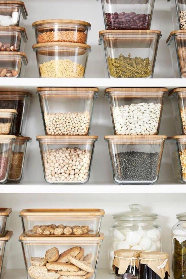 Wood-topped storage jars enhance rustic charm, fitting ikea pantry ideas.