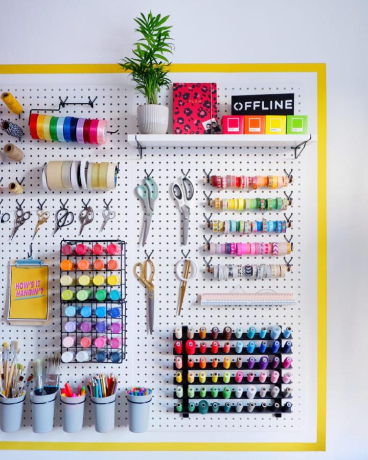 Colorful craft pegboard setup from @thatssogemma featuring yellow frame and organized thread storage display.