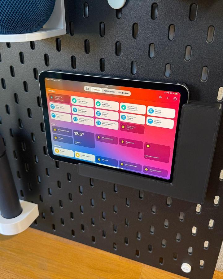 Black pegboard displaying colorful smart home dashboard, showcasing ikea skadis pegboard hacks & ideas from @matthias_petrat.