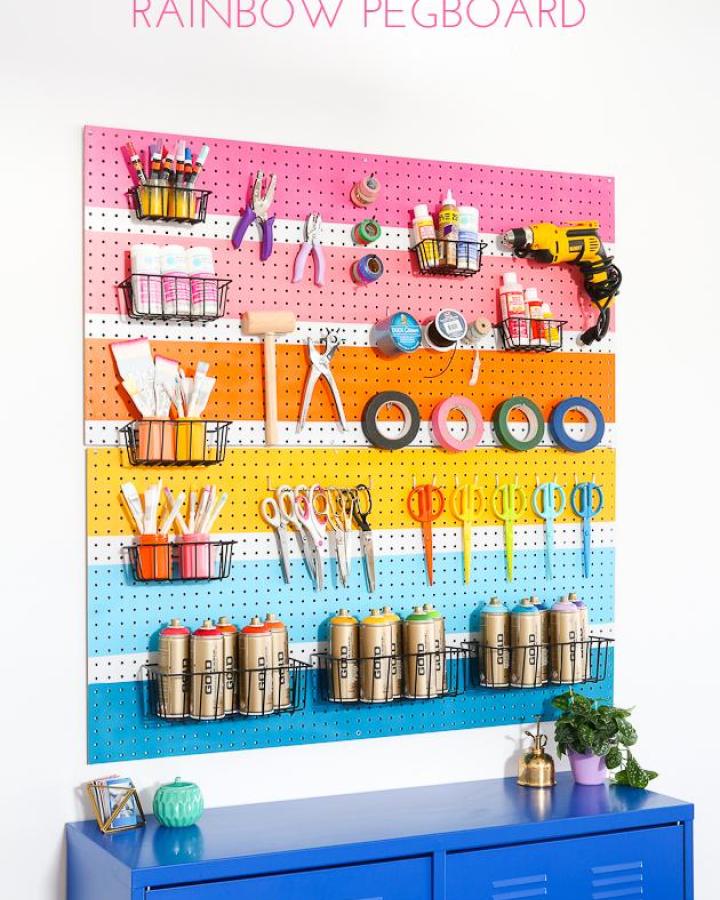 Colorful rainbow pegboard craft storage from The Crafted Life with organized supplies and wire baskets.