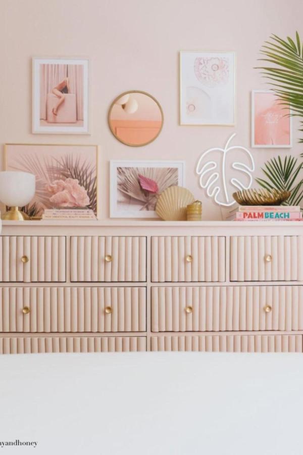 Fluted wood panel dresser makeover from @indoor__outdoor featuring vertical grooves and warm peachy tones.