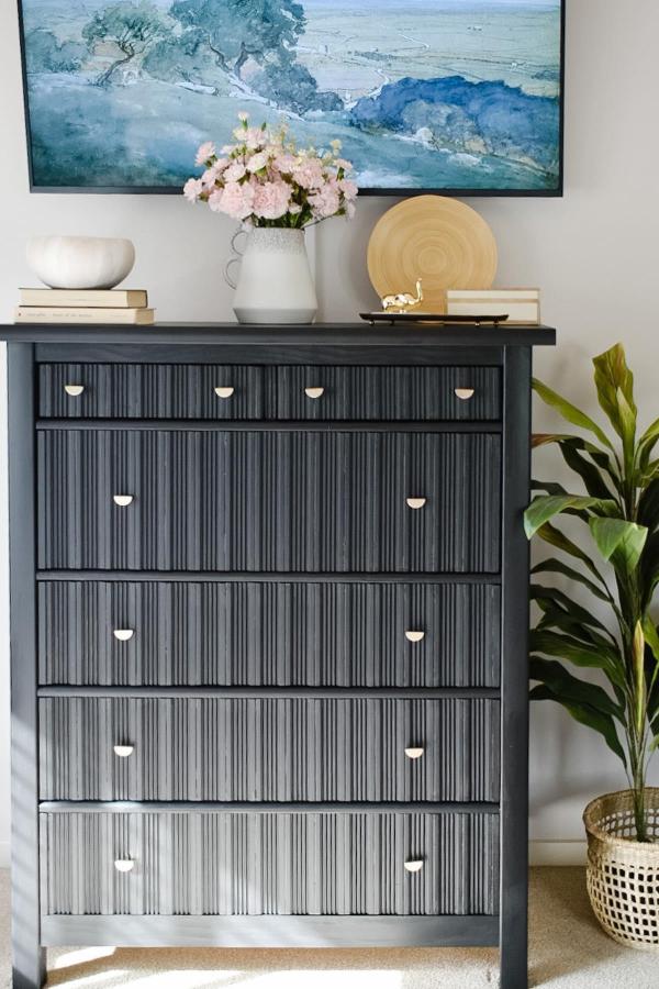 Charcoal fluted dresser makeover from @maisonbymaddyghosh. Vertical wood strips create textured drawer fronts on painted furniture.