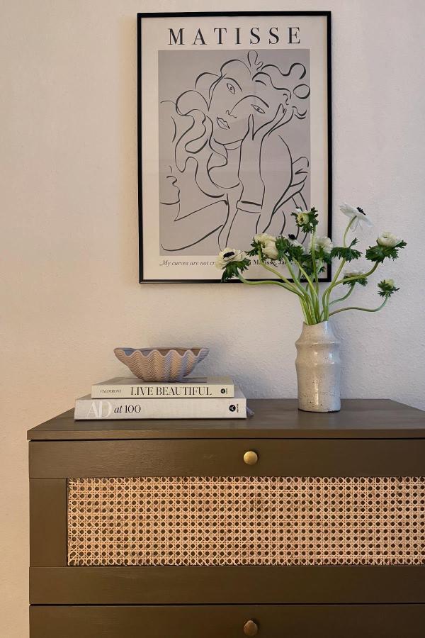 Olive green dresser with cane webbing detail showcasing creative ikea dresser hacks & ideas from @nahiasatelier.
