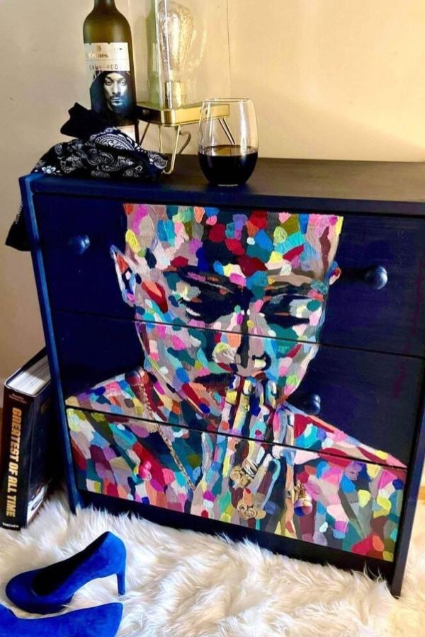 Colorful mosaic-patterned dresser from @ikeahackersofficial. Black furniture transformed with geometric paper cutouts.