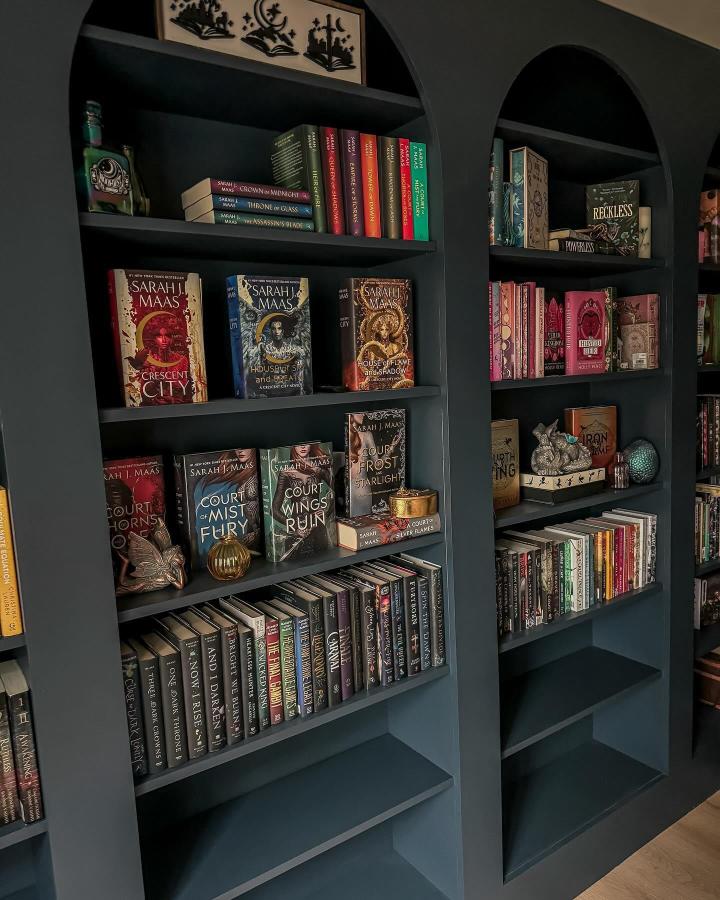 Forest green painted built-in style bookcases from @mikaelaspageturners showcasing creative transformations.