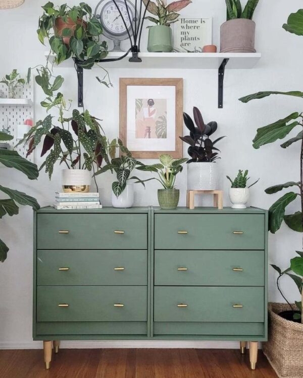 Sage green painted chest of drawers from @2nddoorontheright showcasing ikea rast hacks & ideas with brass hardware and wooden legs.