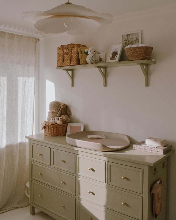 Sage green Hemnes dresser showcasing ikea baby room hacks & ideas from @la_booij with brass handles and woven storage.