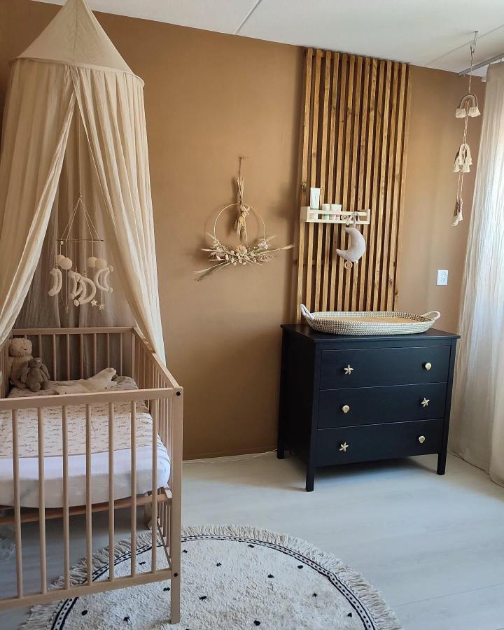 Navy painted Hemnes dresser from @zosammy.wonen with gold star handles and woven changing basket on top.