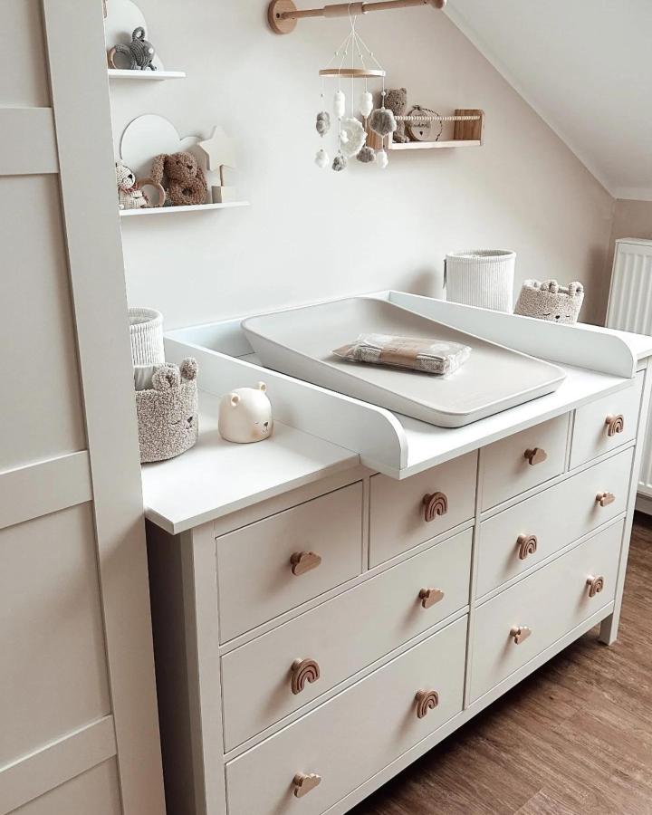 White Hemnes dresser from @jennifer.maria.b with terracotta rainbow handles as changing station