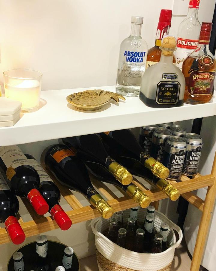 White and bamboo ikea bar cart hacks & ideas from @thesundaystylist showcasing wine and spirits storage