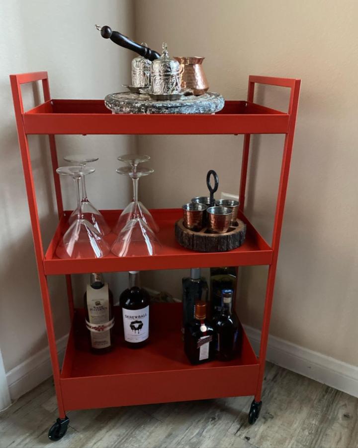 Coral-red bar cart from @learnwithmyra showcasing ikea bar cart hacks & ideas with wood and metal styling.