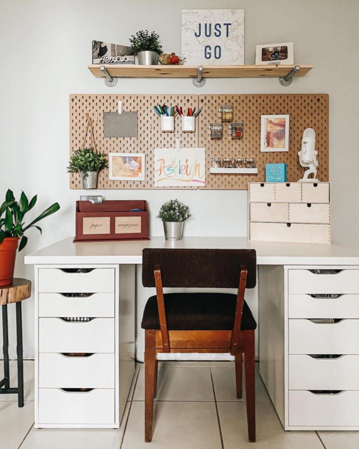 Natural pegboard craft station from @candidlyashleigh with white desk and organized supply display.