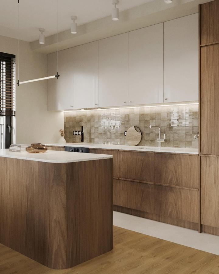 Warm oak and cream kitchen from @qood.design with textured zellige backsplash and wooden island base.