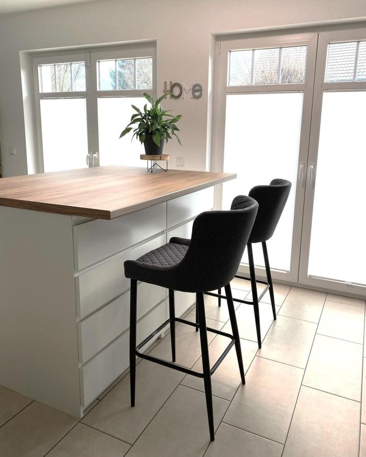 White Malm drawer island with wood countertop from @unsere_finca_toro showing ikea kitchen island ideas with bar seating.
