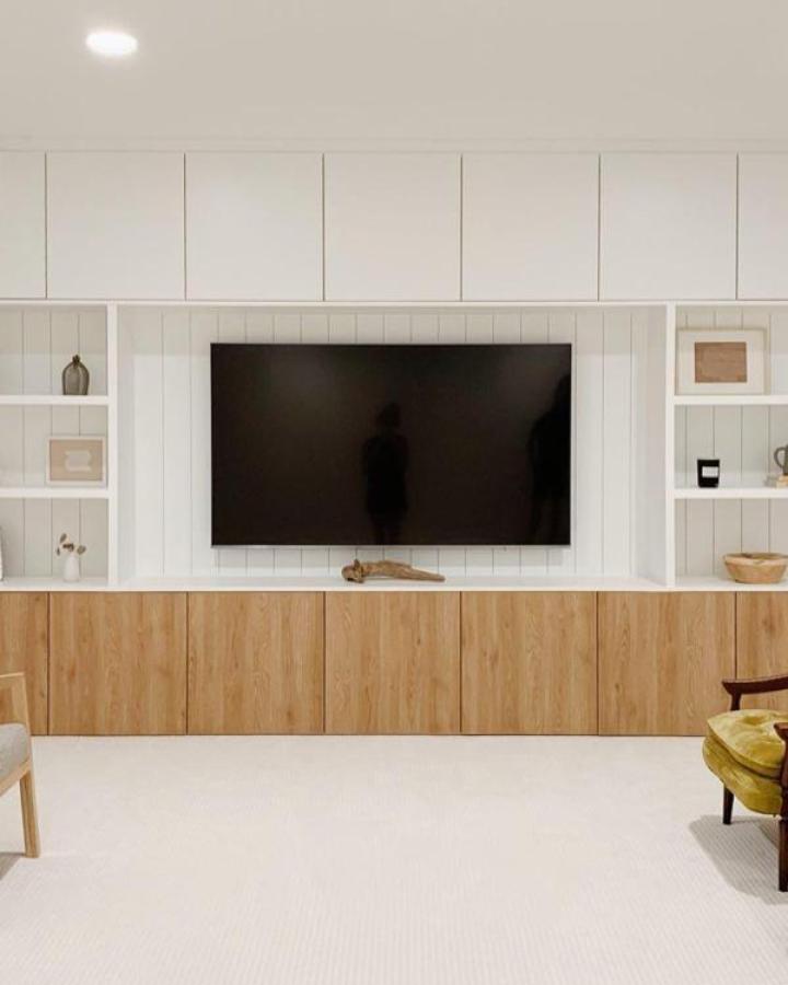 Two-tone media wall from @mysimplysimple featuring white shiplap and oak Besta cabinets with open shelving.