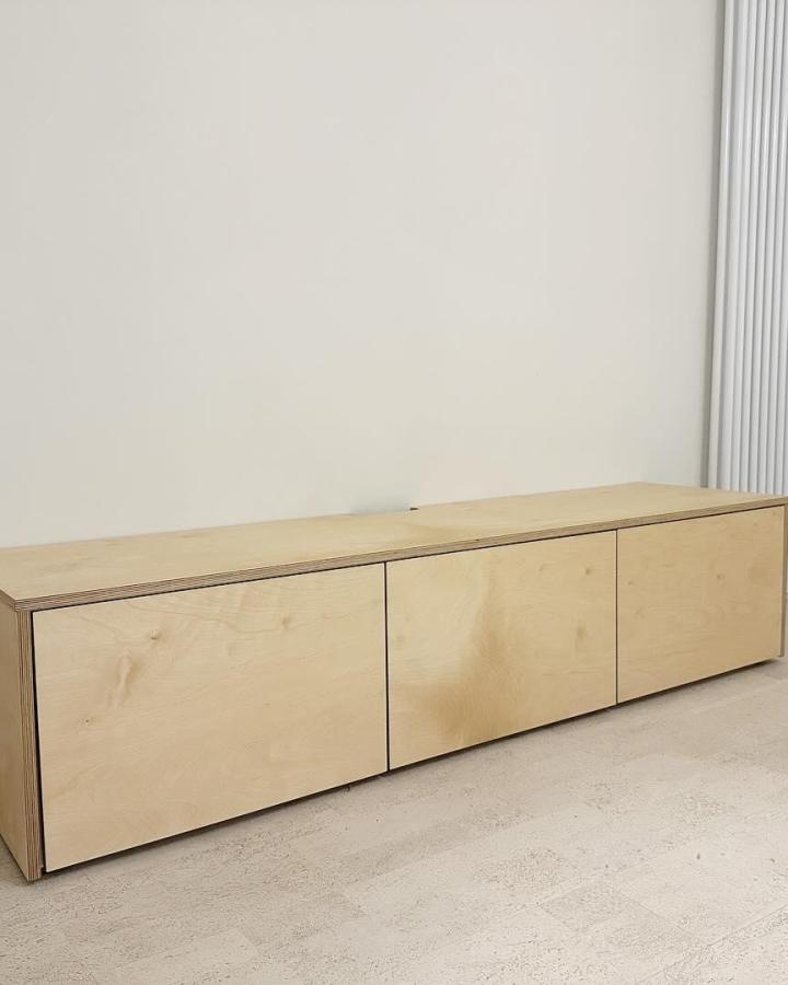 Natural plywood media console from @sdmwilliams with exposed edge details and minimalist Scandi styling.