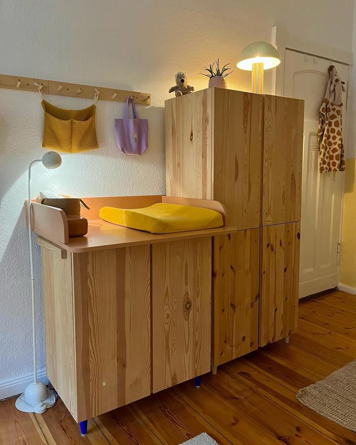 Natural pine ikea nursery storage hacks & ideas from @bjorkandpine featuring Ivar cabinets as changing station.