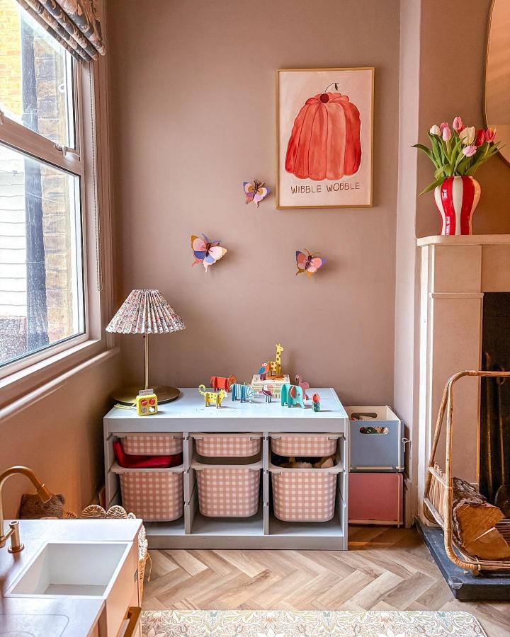 Pink gingham Trofast storage unit from @_itstartedwithacushion in beige nursery with