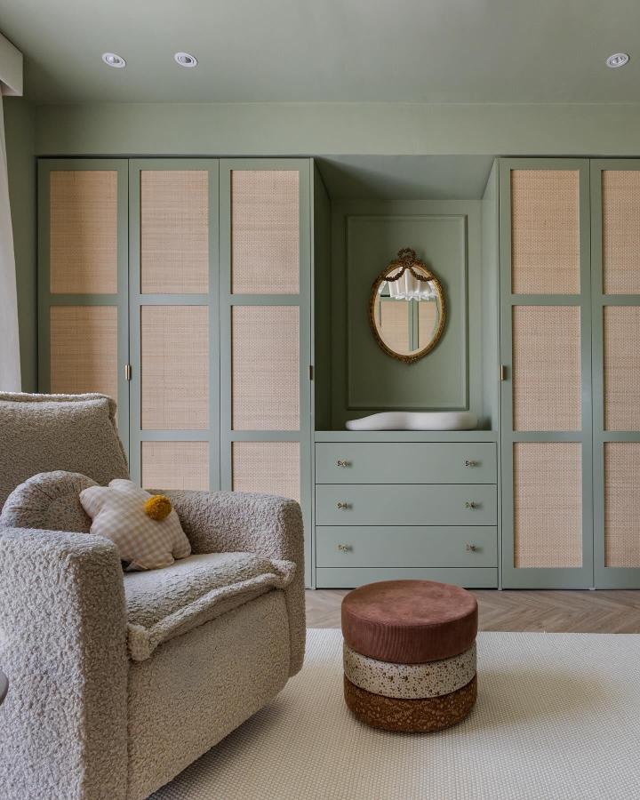 Sage green Ikea Pax wardrobes with cane panel inserts from @stepintodetail. Built-in changing station between units.