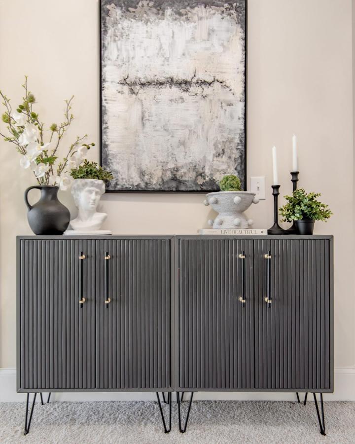 Gray fluted Ikea Eket cabinet from Wander In Color with gold hardware and hairpin legs.