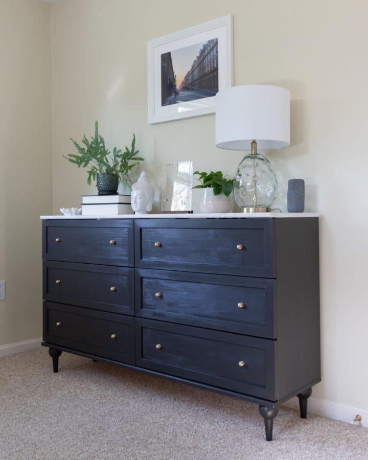 Navy blue stained dresser from Handmade Weekly with brass hardware and decorative turned legs.