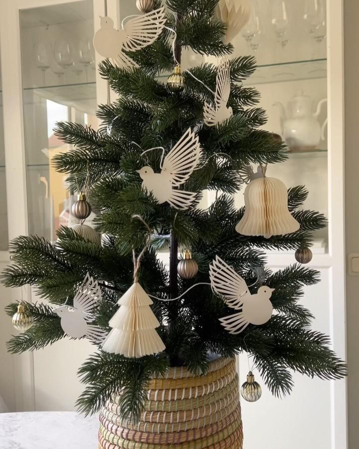 Decorated Ikea Vinterfint tree with wooden dove ornaments from @stallgatan1 showing ikea christmas decoration hacks & ideas in natural tones.