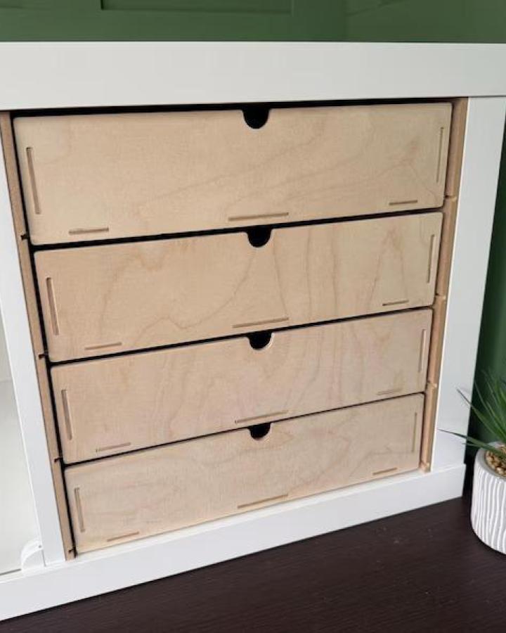 Natural plywood Kallax drawer inserts from decoblanks with black circular pulls for organized storage.