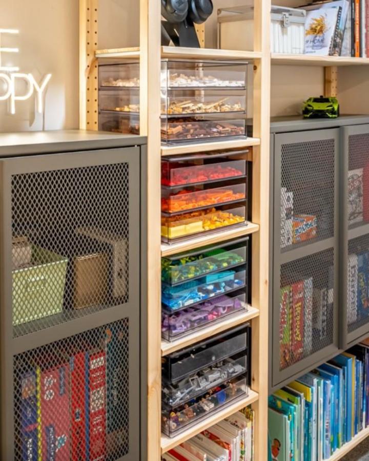 Gray mesh cabinets and rainbow acrylic drawers in Ivar shelves from @letsboardit for organized brick storage.