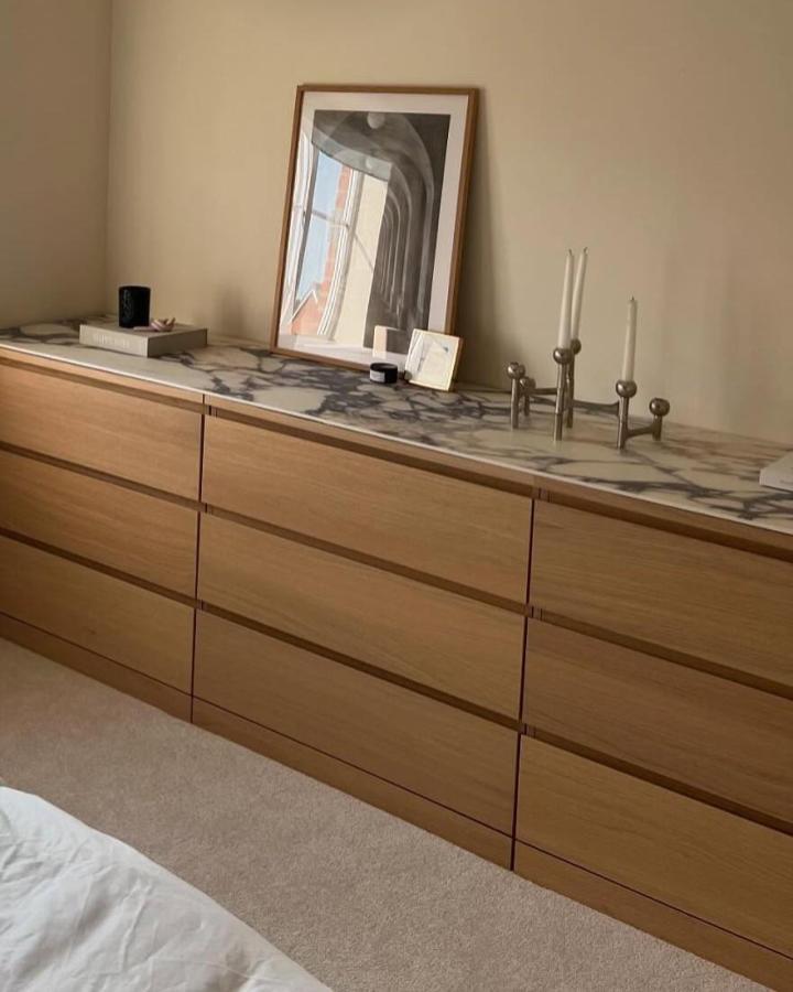 light wood dresser with marble top from @sawbo_townhouse showcasing ikea malm hacks & ideas in a bedroom setting with minimalist decor
