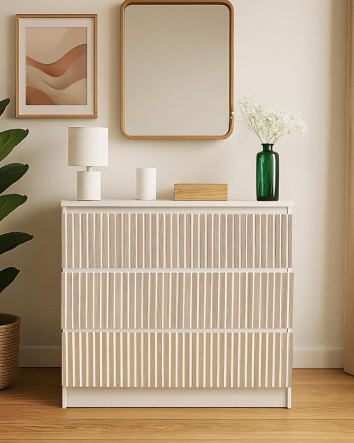 white and natural wood vertical slat dresser in neutral room with green vase and round mirror from @guippdecor ikea malm hacks & ideas