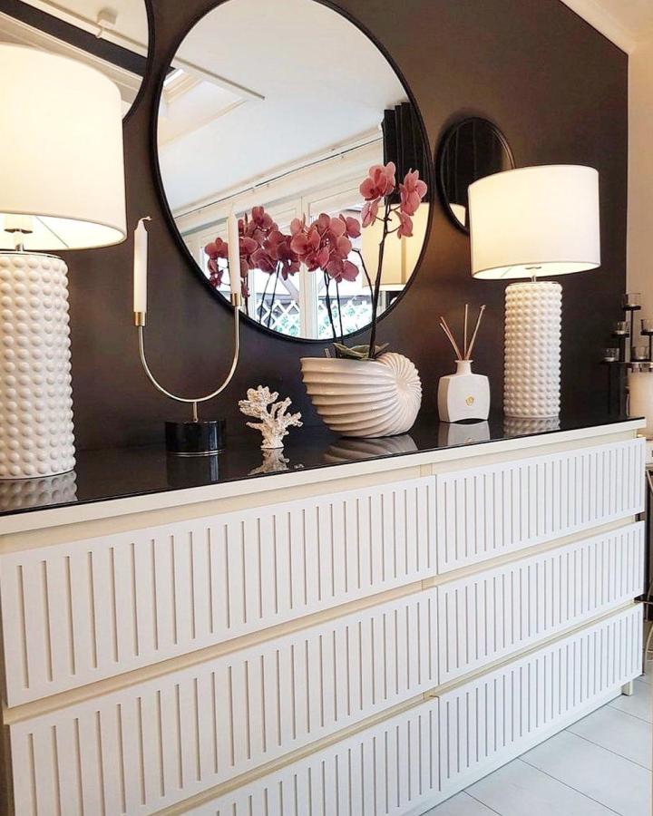 white vertical slatted drawer dresser with decorative lamps and orchids from @frontcover.se sophisticated ikea malm hacks & ideas