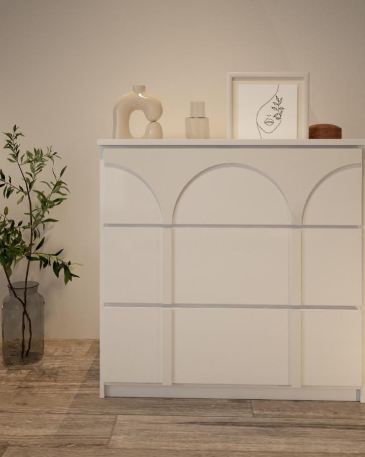 white modern minimalist dresser with arched facade details from @casadart with neutral decor and wooden floor ikea malm hacks & ideas