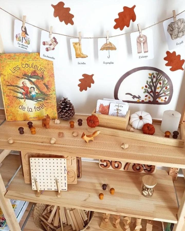 Natural wood Ivar shelf display from @bois.et.couleurs featuring ikea montessori hacks & ideas with autumn-themed learning materials and toys