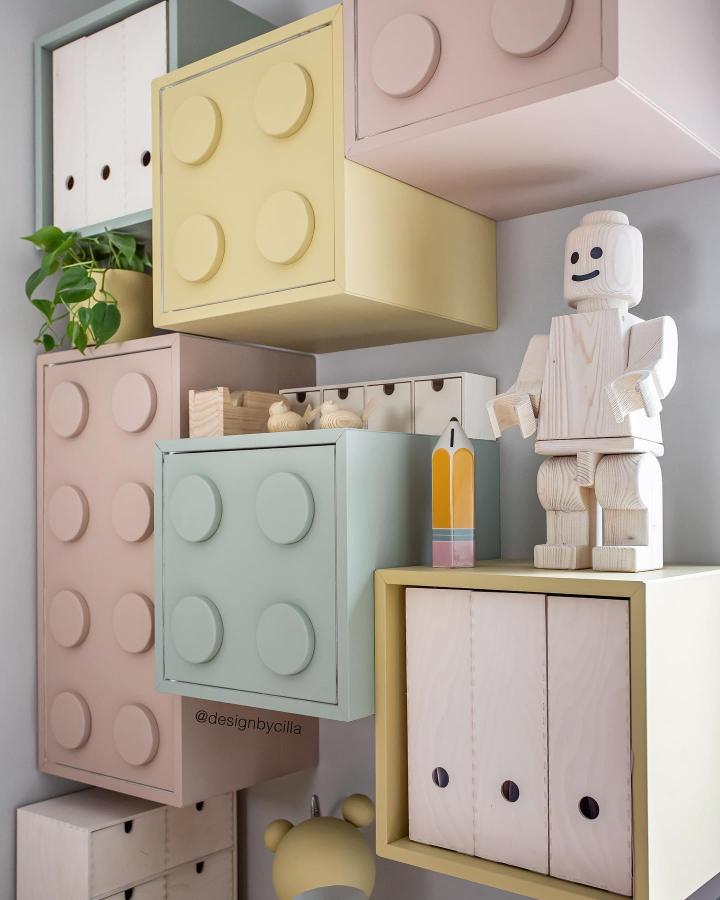 Pastel Lego-style Ikea Eket units from @designbycilla. Mounted at playful heights with circular wooden studs.