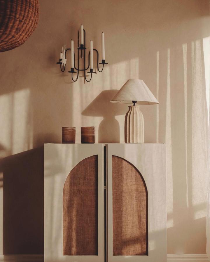 Cream cabinet with cane door inserts from @sanna.emelie showcasing restoration hardware hacks & ideas with natural textures.