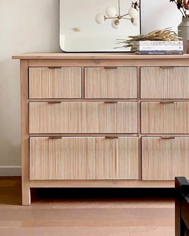 Natural wood dresser with fluted dowel drawer fronts from @abby_roadhome. Ikea Hemnes hack with textured details.