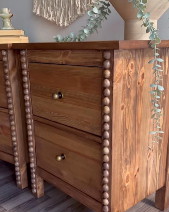 Walnut-stained nightstands with wooden bead trim from @something.renewed. Ikea Hemnes hack with textured corner details.