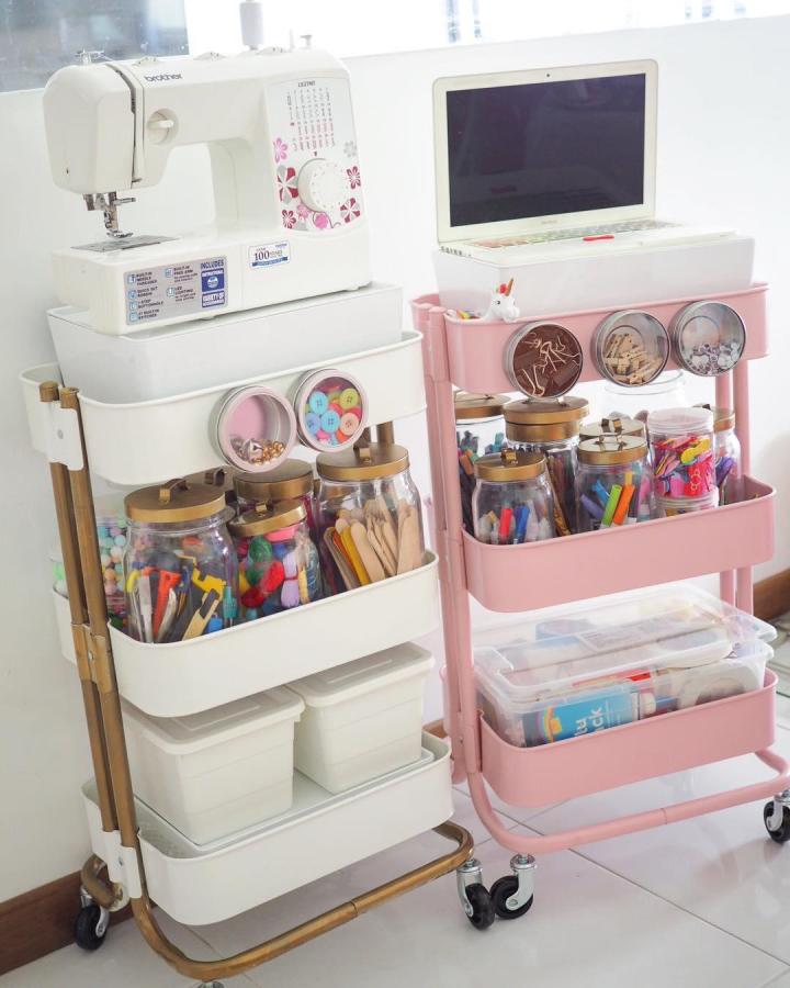 Pink and white mobile craft storage carts with clear jars from @ivmouse filled with craft supplies and tools