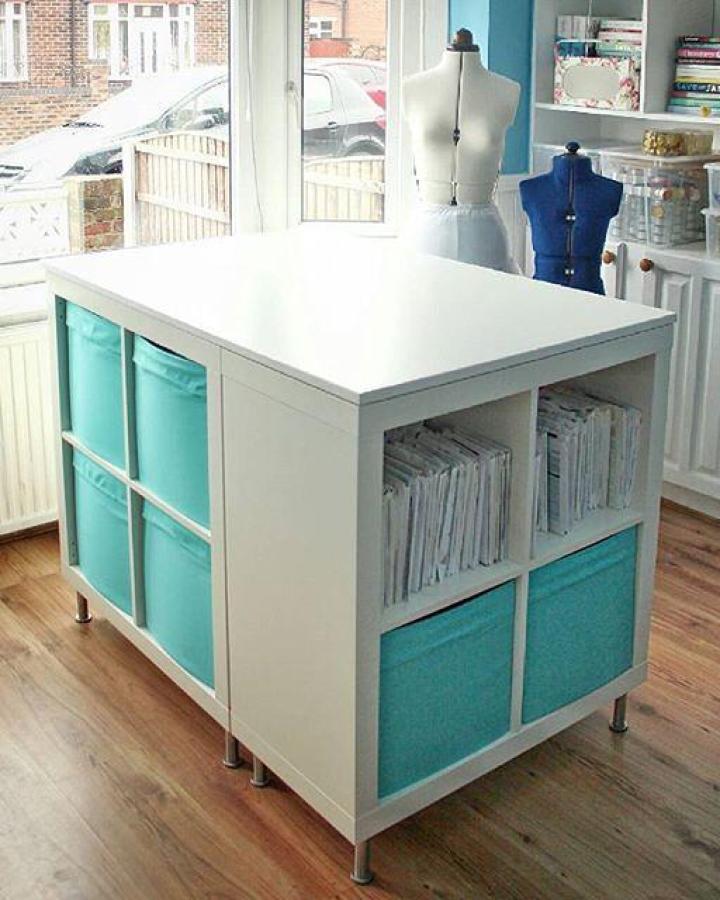 white ikea kallax craft table hacks with turquoise fabric bins and metal legs in bright craft room