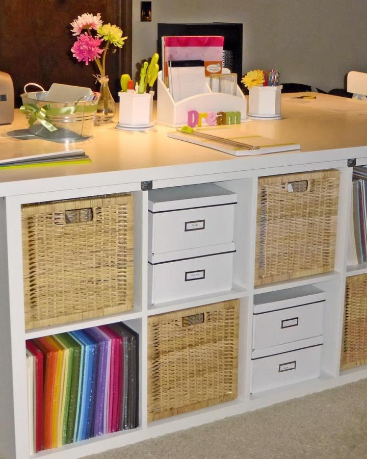 White Ikea kallax craft table hacks with wicker baskets and labeled white boxes from @mwoerner. Neat, colorful craft storage solution.