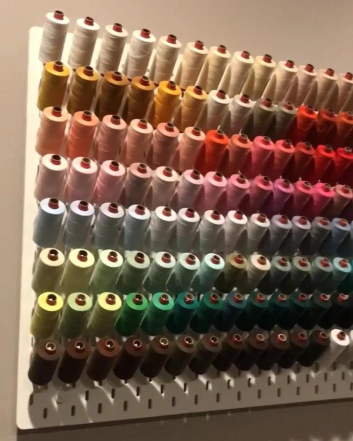 white Ikea Skadis pegboard craft room thread display from SYNERGY3DAu showing colorful spools organized by shade