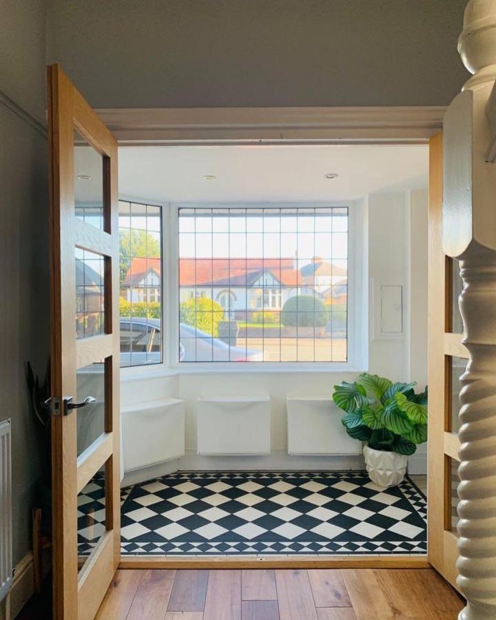 white minimalist Ikea Trones storage units in bright entryway by @beyondtheblankcanvas perfect ikea storage hacks & ideas with black white tiled floor