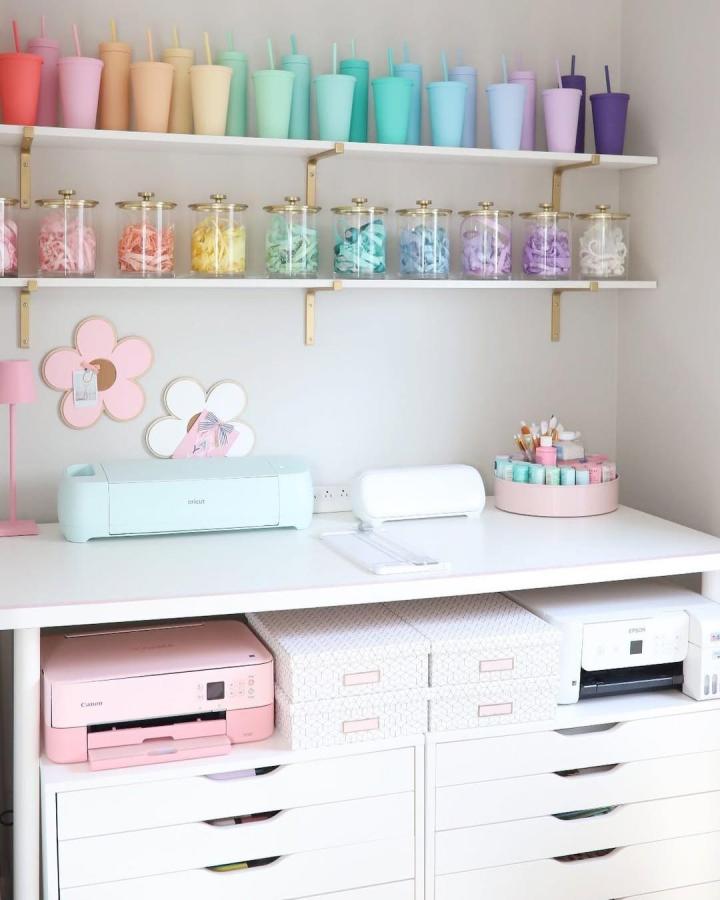 Pastel and white Ikea Alex Drawers craft space from @homesweetpink with colorful jars and organized Cricut supplies.