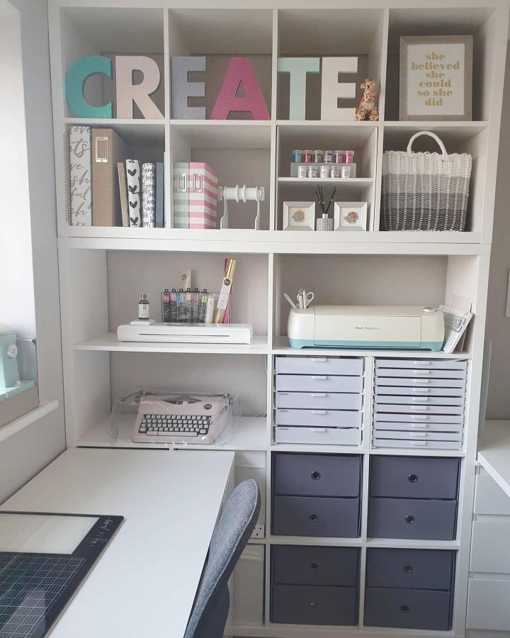 White Ikea Kallax shelving with gray drawers and pastel accents from @hannascraftroom for ikea cricut storage ideas.