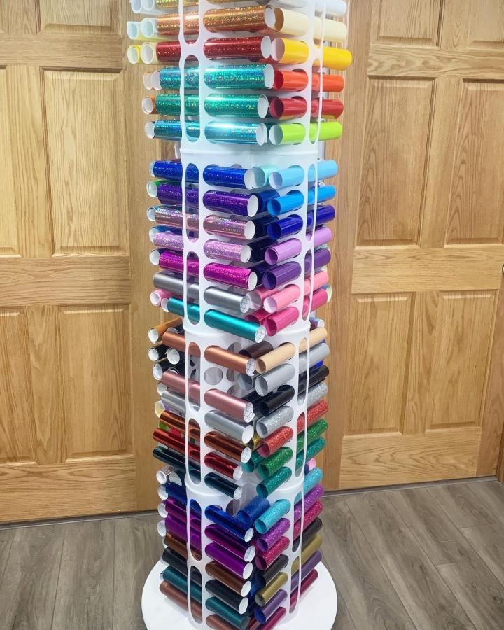 White plastic vertical Ikea Variera bag holders craft storage tower from @hiddenridgedesigns holding colorful vinyl rolls neatly.