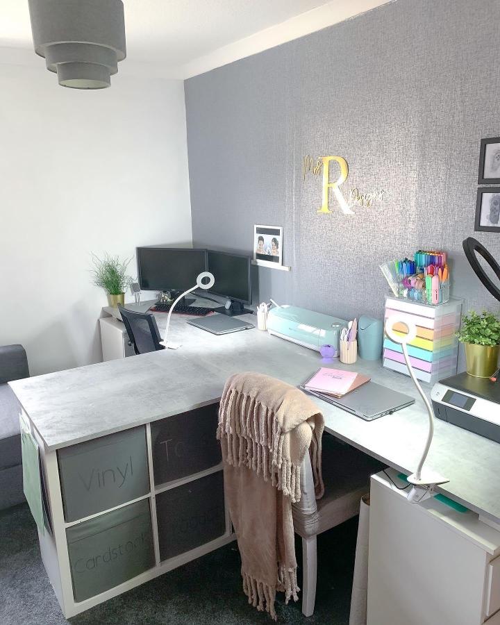Grey and white Ikea Kallax craft storage corner with labeled bins and colorful supplies from @richardson_house for ikea cricut storage ideas