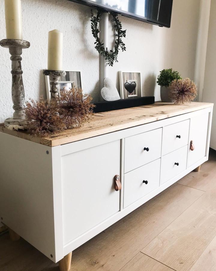 white and natural wood Ikea Kallax makeover ideas sideboard with black knobs and leather handles from @jennys_landhausliebe